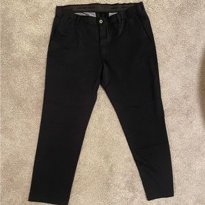 Men’s black Under Armor golf pants. Size 42/32. Brand new.